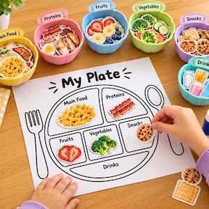 Peut inclure: Un jeu de tri alimentaire comprenant une feuille de papier blanche avec un diagramme My Plate et six bols en plastique colorés étiquetés Main Food, Proteins, Fruits, Vegetables, Snacks et Drinks, remplis de découpes en papier.