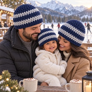 May include: Three matching crochet beanies in navy blue and light gray. Each hat features a textured, repeating stitch pattern with horizontal stripes of light gray alternating with solid navy blue sections, creating a uniform look for all three.