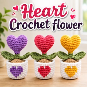 May include: Three crocheted heart-shaped flowers in white pots. Each flower has a heart-shaped bloom in purple, red, or yellow, green leaves, and a tan base. The white pots feature a matching heart design. Text reads: Heart Crochet flower.