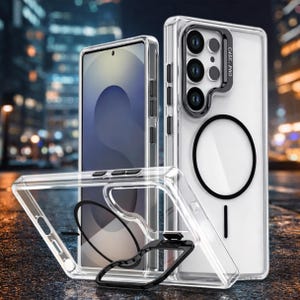 May include: Transparent phone cases with a black ring and a black handle. The cases are designed to protect the phone and have a sleek, modern appearance. The cases are shown in front of a blurred city background.