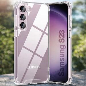 Puede incluir: Funda protectora transparente para Samsung S23. La funda es transparente con un diseño de parachoques reforzado. El logotipo de Samsung es visible en la parte inferior. La pantalla del teléfono muestra el texto "Samsung S23".