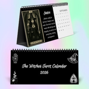 May include: A desk calendar with a black and white design, featuring a tarot card image of Justice. The calendar shows the month of September and the text "The Witches Tarot Calendar 2026". The Justice card depicts a witch.