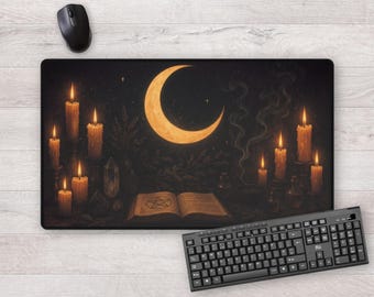 May include: A black rectangular mouse mat with a crescent moon, candles, and an open book with a pentagram. The design includes a starry night sky and smoke, with a black mouse and keyboard.