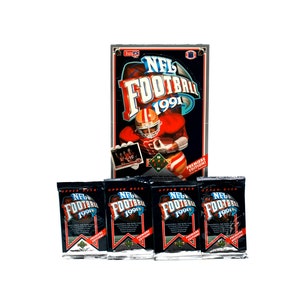 May include: A collection of 1991 NFL Football trading card packs and a box. The box features a football player in a red uniform and the text "NFL Football 1991". The packs are black with the same logo.