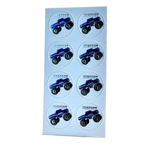 May include: Sheet of stickers featuring a blue monster truck design with the word "BIGFOOT" in a circular frame. The stickers are arranged in rows and columns on a white background.