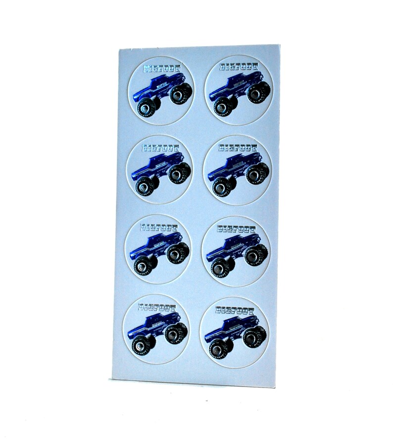 May include: Sheet of stickers featuring a blue monster truck design with the word "BIGFOOT" in a circular frame. The stickers are arranged in rows and columns on a white background.