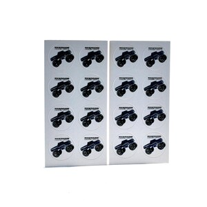 May include: Two sheets of stickers featuring a black monster truck design. Each sticker is round with the truck in the center and text at the top. The stickers are on a white background.