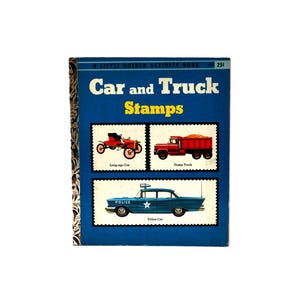 May include: A vintage "Little Golden Activity Book" titled "Car and Truck Stamps." The cover is blue with illustrations of a red antique car, a red dump truck, and a blue police car. The book's title is in white and yellow.