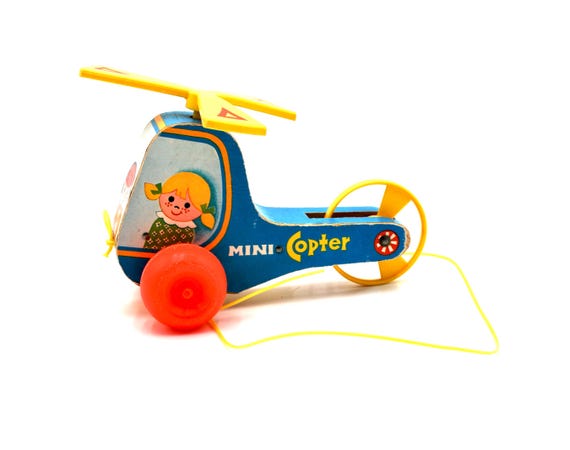 ヴィンテージ　フィッシャープライス　ミニコプター　　　　　　　トイストーリー Fisher Price Mini Copter Pull Toy 448 - Etsy