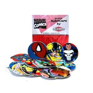 May include: A collection of Marvel Comics Slamcaps, featuring various comic book characters. The Slamcaps are round, with colorful illustrations of Spider-Man, Wolverine, and The Punisher. The packaging reads "Marvel Comics" and "Collector Slamcaps by Slamco."