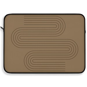 May include: A rectangular laptop sleeve in a solid tan color featuring a dark brown graphic print of two interlocking, rounded line patterns that create a continuous, flowing shape across the center of the front surface with a black zipper.