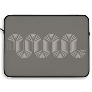 May include: A rectangular laptop sleeve in a solid dark gray color featuring a centered graphic of light gray concentric wavy lines that form a continuous, repeating pattern across the front surface of the protective case.