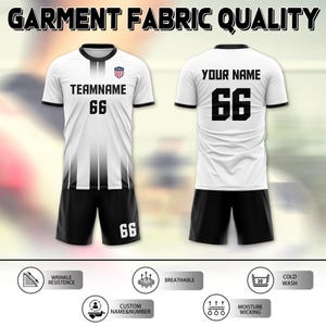 May include: White soccer jersey and shorts set. The jersey has black accents, the text "TEAMNAME" and the number "66". The shorts are black with the number "66". The text "GARMENT FABRIC QUALITY" is at the top.