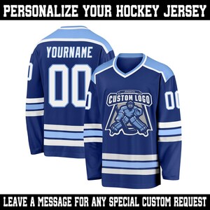 May include: Two blue hockey jerseys with white and light blue accents. One jersey displays "YOURNAME" and the number "00". The other jersey features a custom logo and the number "00". The text "PERSONALIZE YOUR HOCKEY JERSEY" and "LEAVE A MESSAGE FOR ANY SPECIAL CUSTOM REQUEST" are displayed.