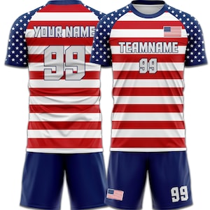 May include: A red and white striped soccer jersey and shorts set with blue sleeves featuring a star pattern. The jersey displays the text "YOUR NAME" and the number "99" on the back, and "TEAMNAME" and "99" on the front, with an American flag.