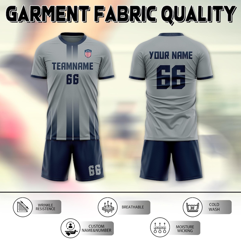 May include: A gray soccer uniform set with navy blue accents, featuring the text "TEAMNAME" and the number "66" on the front and back. The uniform includes a jersey and shorts, with the text "GARMENT FABRIC QUALITY" at the top.