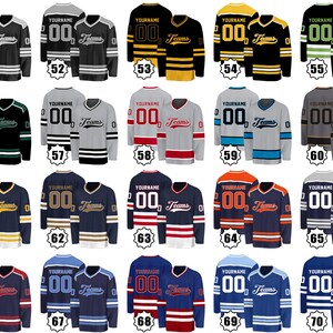 May include: Collection of customizable hockey jerseys in various colors, including black, navy, red, and gray. Each jersey features the text "YOURNAME", "00", and "Teams". The jerseys have striped sleeves and hems.