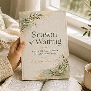 May include: A softcover workbook titled Season of Waiting: A 7-Day Bible Study Workbook for Single Christian Women, Trusting God's Timing with Hope. The cover features a cream background with watercolour botanical illustrations in green and gold.