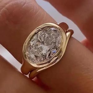 East To West 3CT Oval Cut Moissanite Bezel Set Solitaire Ring, Paired With Matching Curved Shape Plain Band, 925 Sliver Bridal Ring Set