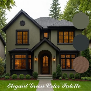 Puede incluir: Una casa de dos pisos de color verde oliva con molduras negras y un tejado gris oscuro. La casa tiene varias ventanas con iluminación interior cálida. El texto "Elegant Green Color Palette" está en la parte inferior de la imagen.