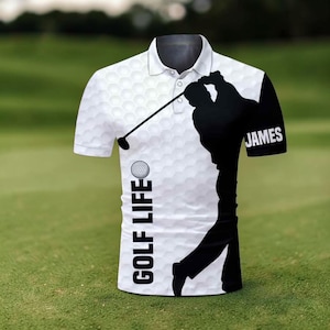 May include: White polo shirt featuring a golf ball pattern and a black silhouette of a golfer swinging a club. The shirt has the text "GOLF LIFE" vertically on the left side and the name "JAMES" on the right sleeve.