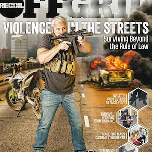 May include: Cover of "OFFGRID" magazine with the title "VIOLENCE IN THE STREETS". The cover features a man holding a rifle, with a motorcycle and burning car in the background. Additional text includes "Surviving Beyond the Rule of Law".