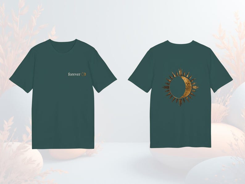 Green unisex organic cotton tee with mystical sun and moon eclipse graphic, boho witchy vibe.