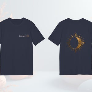 Navy blue celestial astrology tee with gold-effect sun and moon design, unisex fit.