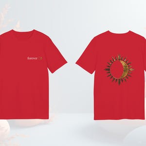 Red unisex t-shirt featuring the sun and moon graphic design, bold celestial style.