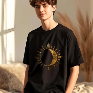Gift for him: Black organic cotton T-shirt with gold sun and moon celestial boho minimalist design.
