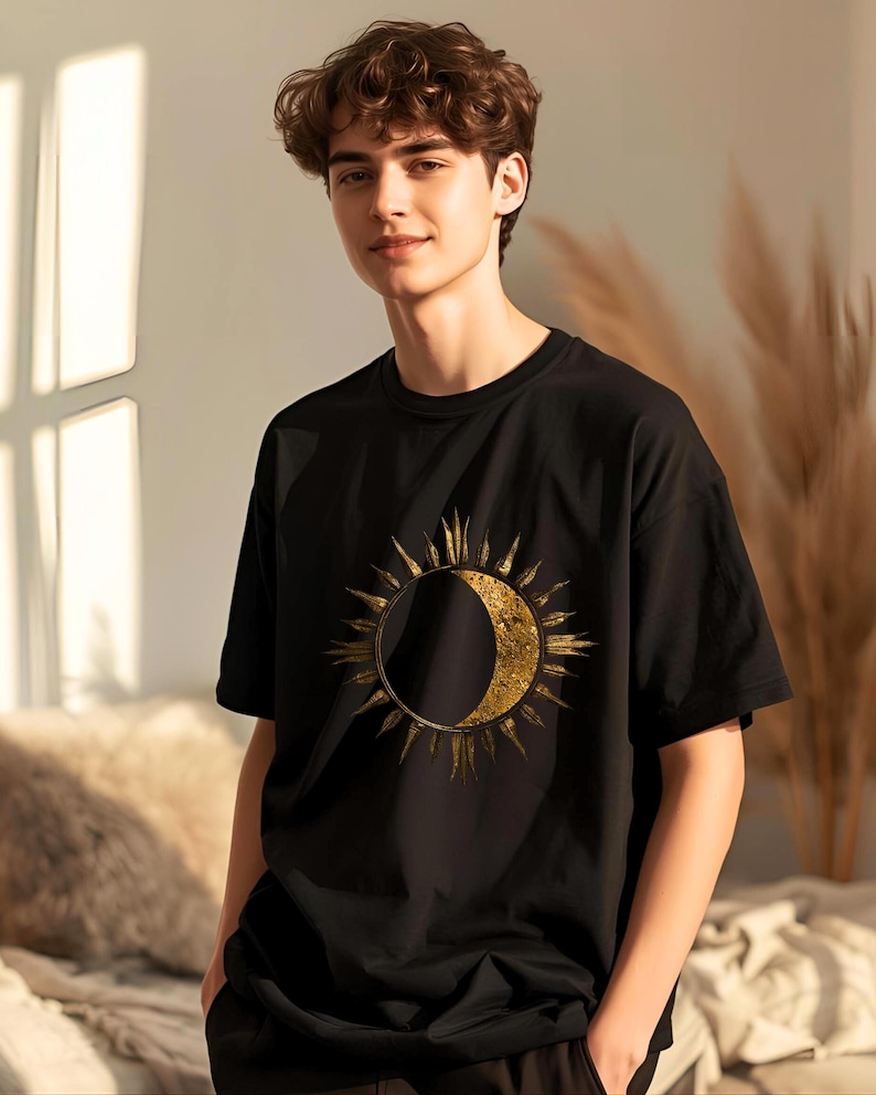 Gift for him: Black organic cotton T-shirt with gold sun and moon celestial boho minimalist design.