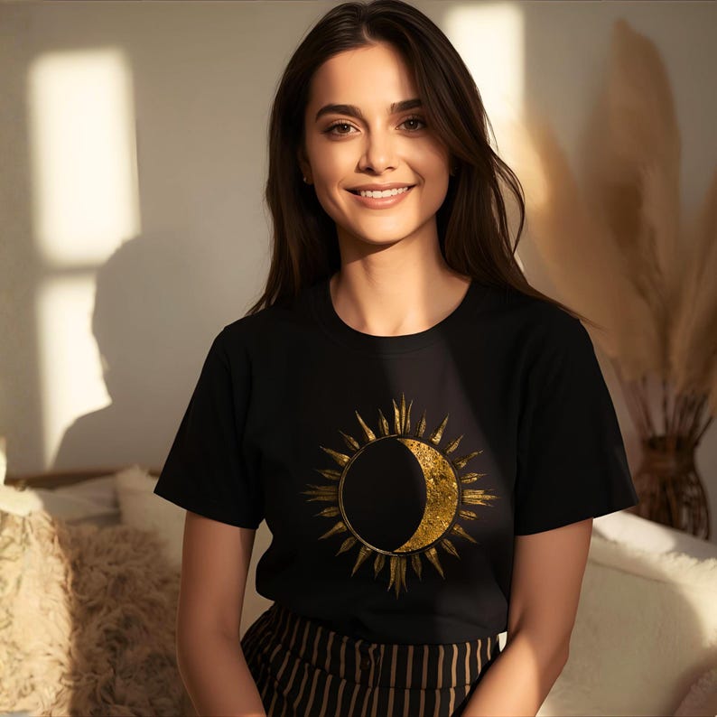 Unisex organic cotton T-shirt featuring a gold textured sun and moon celestial design on the chest. Astrology-inspired minimalist shirt. Boho witchy aesthetic.