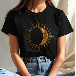 Black organic cotton T-shirt with gold sun and moon celestial design. Minimalist astrology graphic.