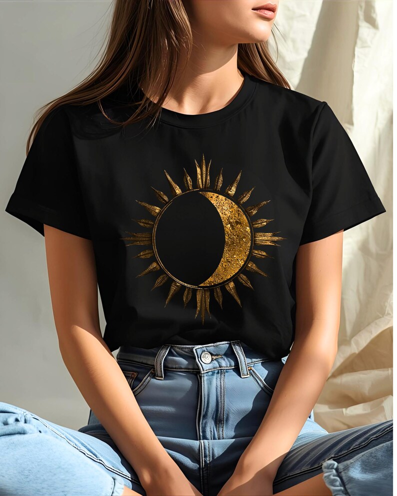 Black organic cotton T-shirt with gold sun and moon celestial design. Minimalist astrology graphic.