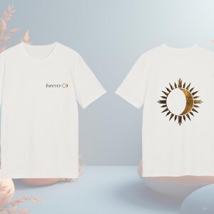White unisex organic cotton t-shirt with gold-effect sun and moon celestial graphic, front and back view. Front side written FOREVER und sun&moon graphic and back a statement sun&moon symbol.