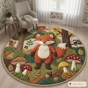 May include: A circular rug with a woodland design, featuring a large orange fox. The rug has a textured, knitted appearance with trees, mushrooms, squirrels, and a badger. The colour scheme includes shades of green, brown, and orange.