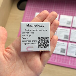 May include: A square white card featuring the text Magnetic.gb, Custom photo magnets, Baby shower, Weddings, Events, Bussiness prom, Magnet sheets, a QR code, and a small horseshoe magnet icon with the text SCAN TO FOLLOW at the bottom.