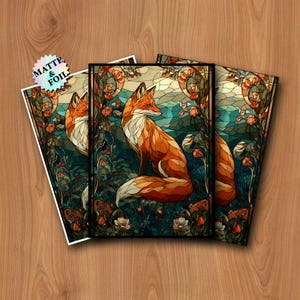 May include: Three art prints featuring a stained-glass style fox in a forest setting. The fox is depicted with orange and white fur, surrounded by flowers and foliage in shades of green, blue, and orange. The prints have a matte and foil finish.
