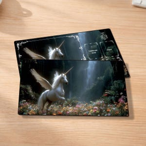 May include: Two rectangular playmats featuring a white unicorn with wings in a colorful flower field, set against a waterfall backdrop. The mats have text that reads "Lut", "Command Zone", and "Exile".