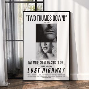May include: Black and white framed movie poster for "Lost Highway" by David Lynch. The poster features the text "TWO THUMBS DOWN!" and images of two faces. The film title is prominently displayed at the bottom.