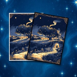 May include: Two art prints featuring a nighttime landscape with a path leading to a castle. The prints have a dark blue and gold color scheme, with a starry sky and a glowing tree. The prints are framed with an ornate gold border.