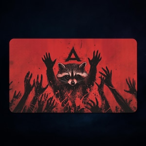 May include: A rectangular red graphic featuring a raccoon with raised arms, surrounded by silhouetted hands. Above the raccoon is a black triangle. The artwork has a distressed, grunge style.