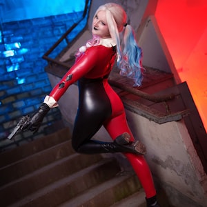 Transform into the iconic and mischievous Harley Quinn with our custom cosplay catsuit!

This catsuit features a vibrant red and black colour scheme, just like the original outfit.