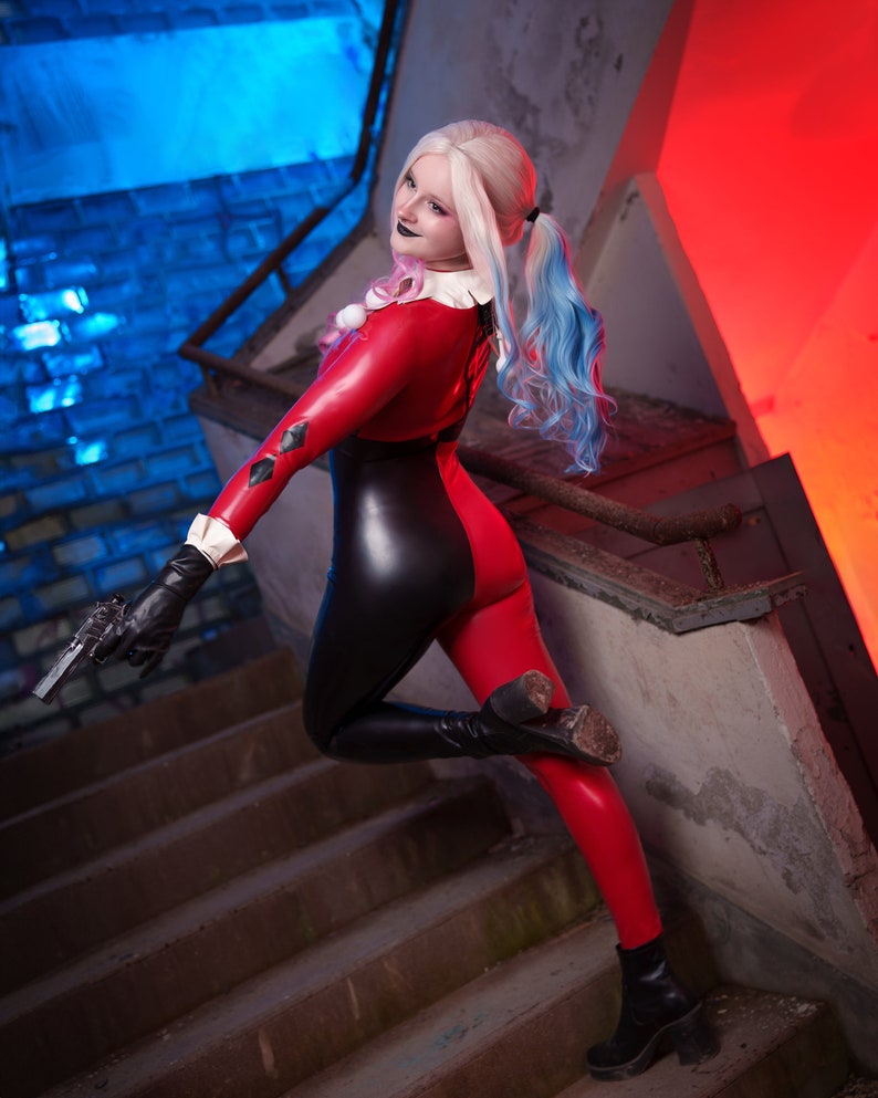 Transform into the iconic and mischievous Harley Quinn with our custom cosplay catsuit!

This catsuit features a vibrant red and black colour scheme, just like the original outfit.