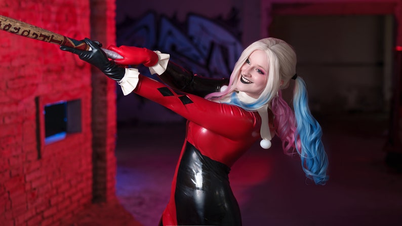 Transform into the iconic and mischievous Harley Quinn with our custom cosplay catsuit!

This catsuit features a vibrant red and black colour scheme, just like the original outfit.