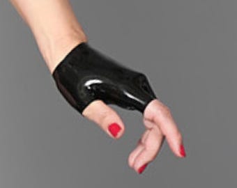 May include: A black fingerless glove made of a smooth, shiny, latex-like material. The glove covers the back of the hand and the palm area, leaving the fingers and thumb exposed. It features a snug, form-fitting design with a glossy finish.