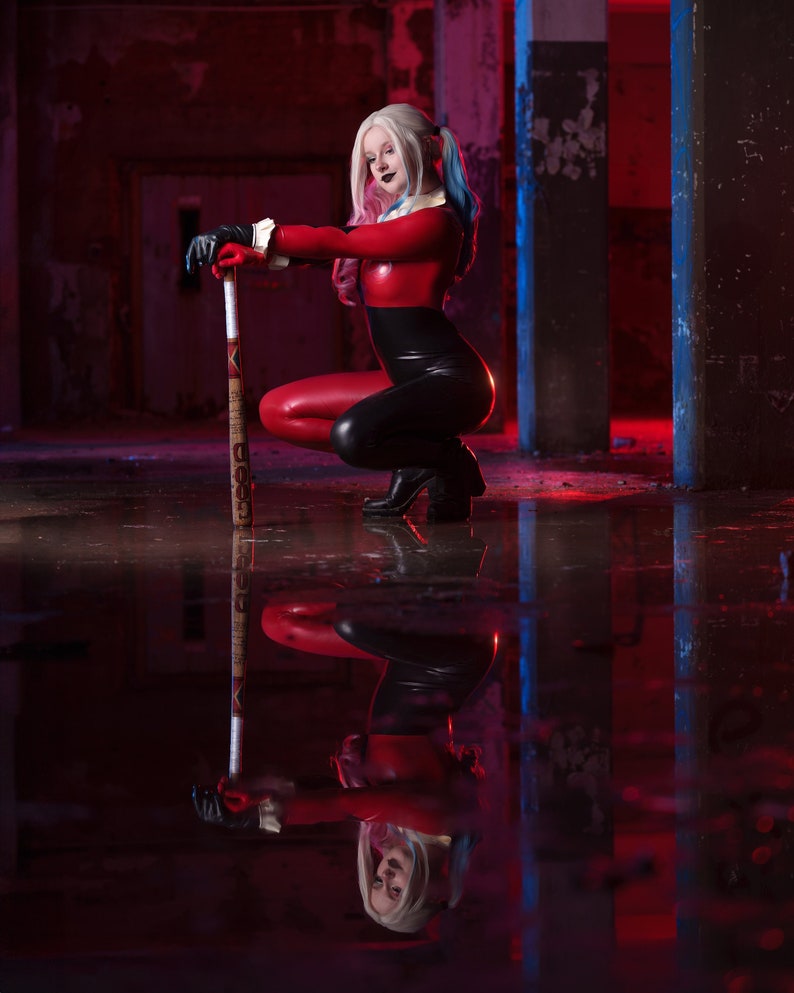 Transform into the iconic and mischievous Harley Quinn with our custom cosplay catsuit!

This catsuit features a vibrant red and black colour scheme, just like the original outfit.