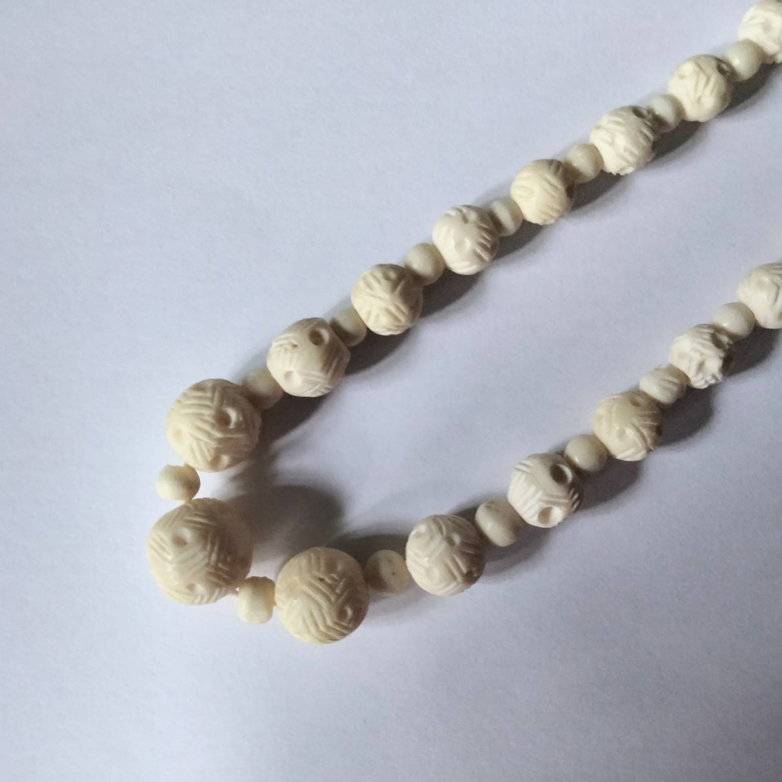 Carved ivory deals bead necklace