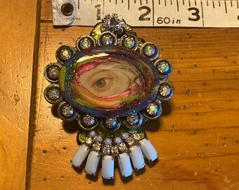 Custom Art Lovers Eye Brooch. Enameled and surrounded by Swarovski. Aurora Borealis Swarovski crystals set in a vintage pot metal base