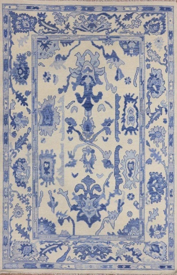 Handmade Wool Oushak Rug: Blue and Ivory Floral Turkish Carpet